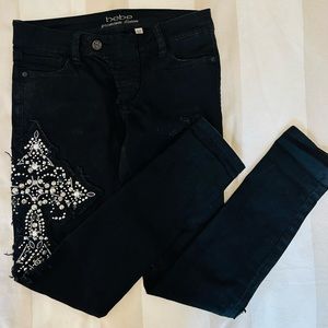 Bebe black Jeans with cross size 28 LIKE NEW